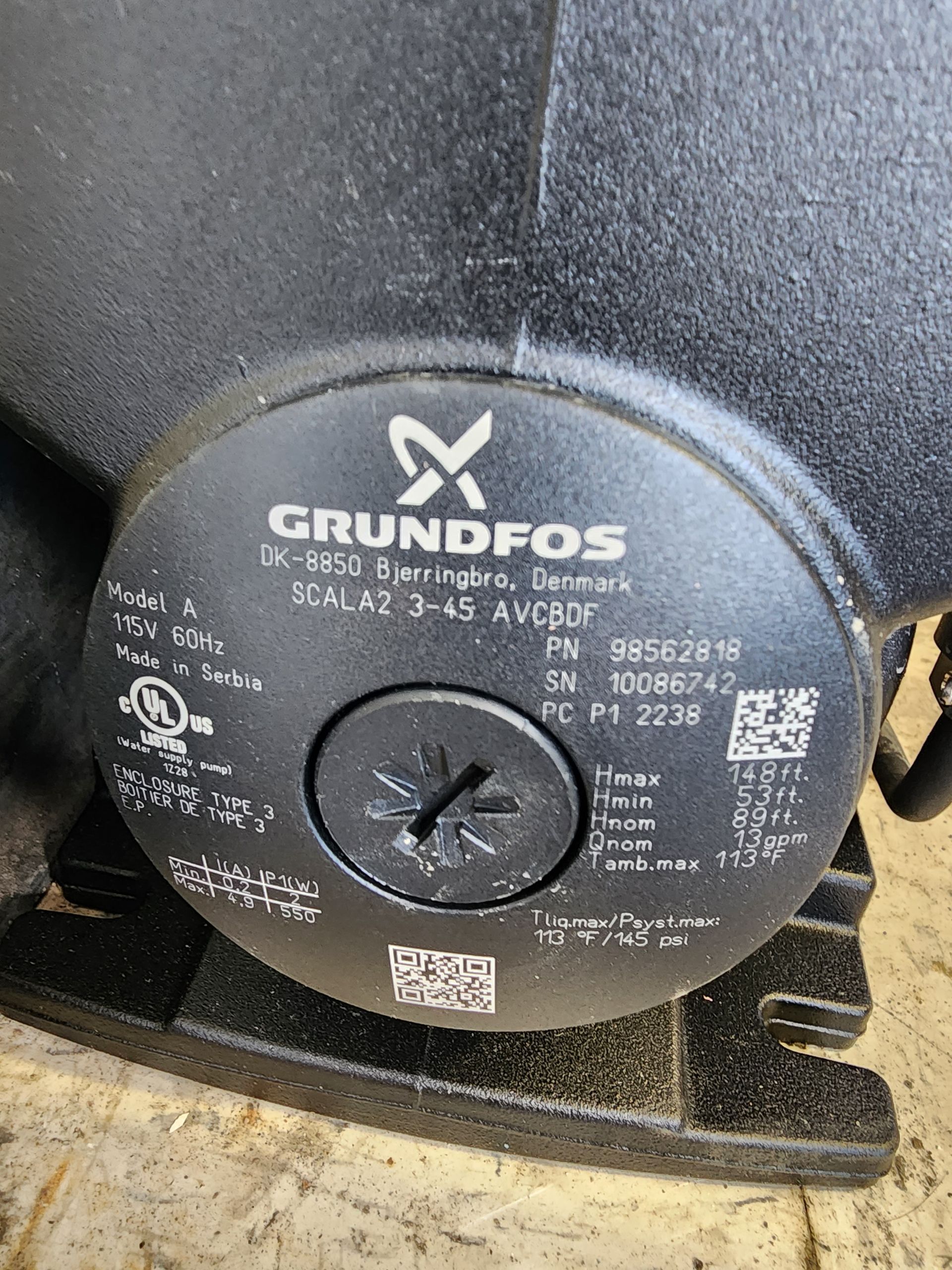 A black grundfos pump is sitting on a table