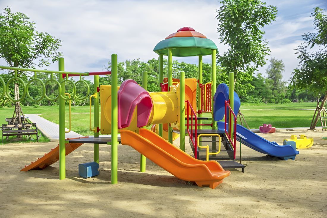 A Colorful Playground in a Park With Trees in the Background — Garden Vogue in Charlestown, NSW