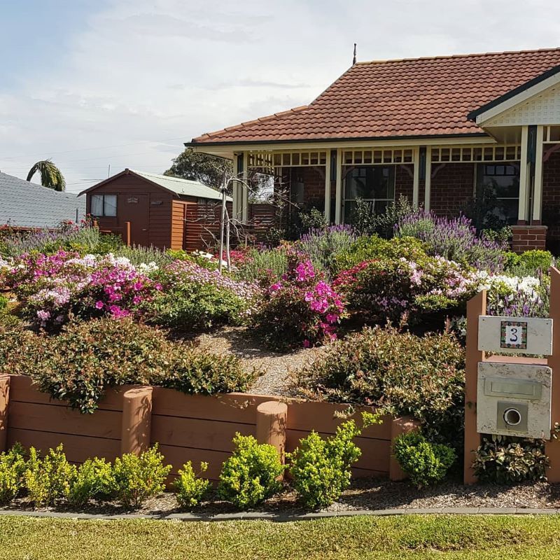 A House With Lots of Flowers in Front of It — Garden Vogue in Charlestown, NSW