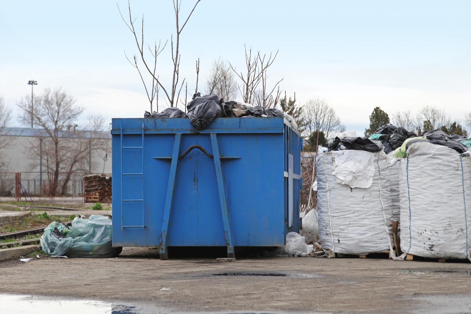 big dumpster near the parking lot