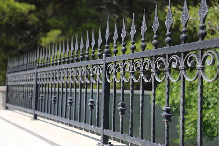 Beautiful metal fence in the park or in the garden 
