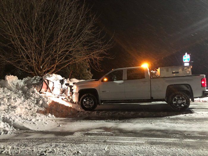 Snow Plow Clearing a Snowy Road — Eden, WI — Baumhardt Sand & Gravel, Inc.