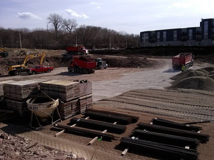 Trucks and Excavator on Construction Site — Eden, WI — Baumhardt Sand & Gravel, Inc.