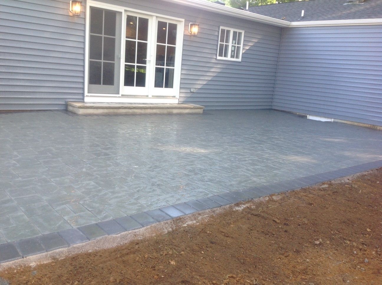 A house with a patio in front of it