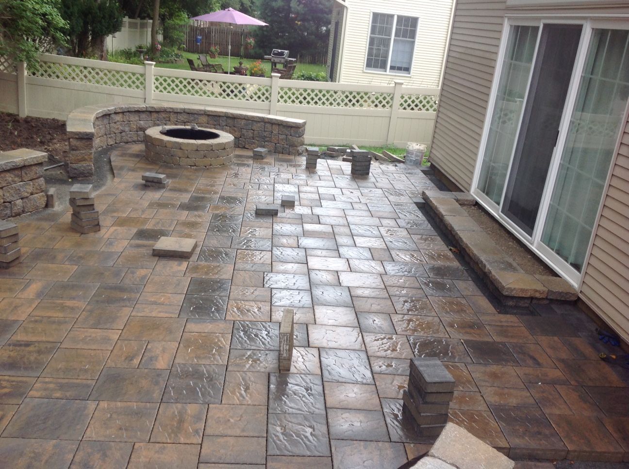 There is a fire pit in the middle of the patio.