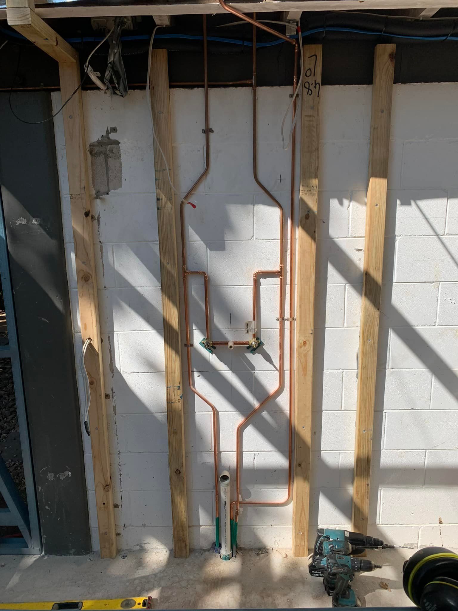 Copper Pipes Installed on A Wall Within a Construction Setting — 2 Foote Plumbing & Gas in Darwin, NT