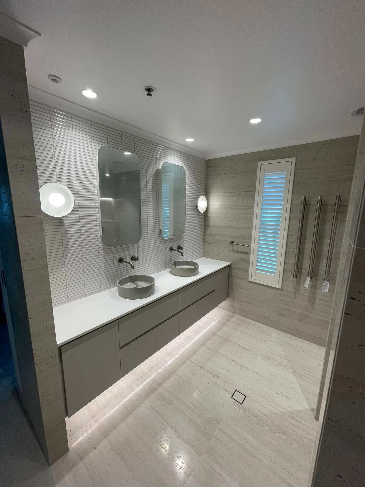Modern Bathroom with Double Sinks, Gray Vanity, Patterned Accent Wall — 2 Foote Plumbing & Gas in Darwin, NT