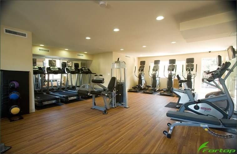 A gym with a lot of equipment and the word fortop on the bottom
