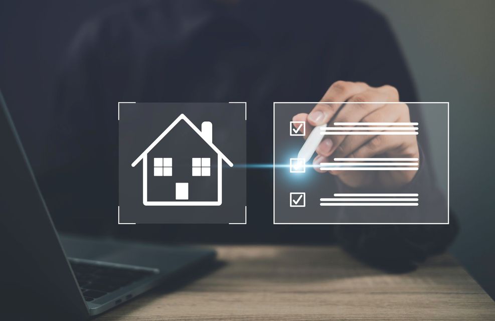 A person is using a laptop computer to check a house.