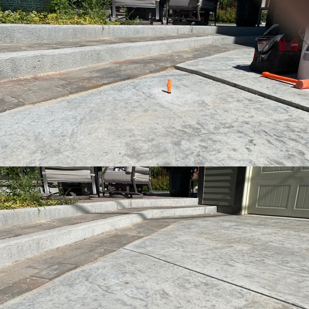 Concrete steps and walkway with a power-washed area.