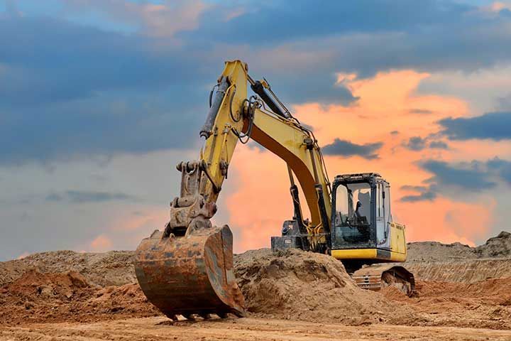 Excavator working on earthmoving at open pit