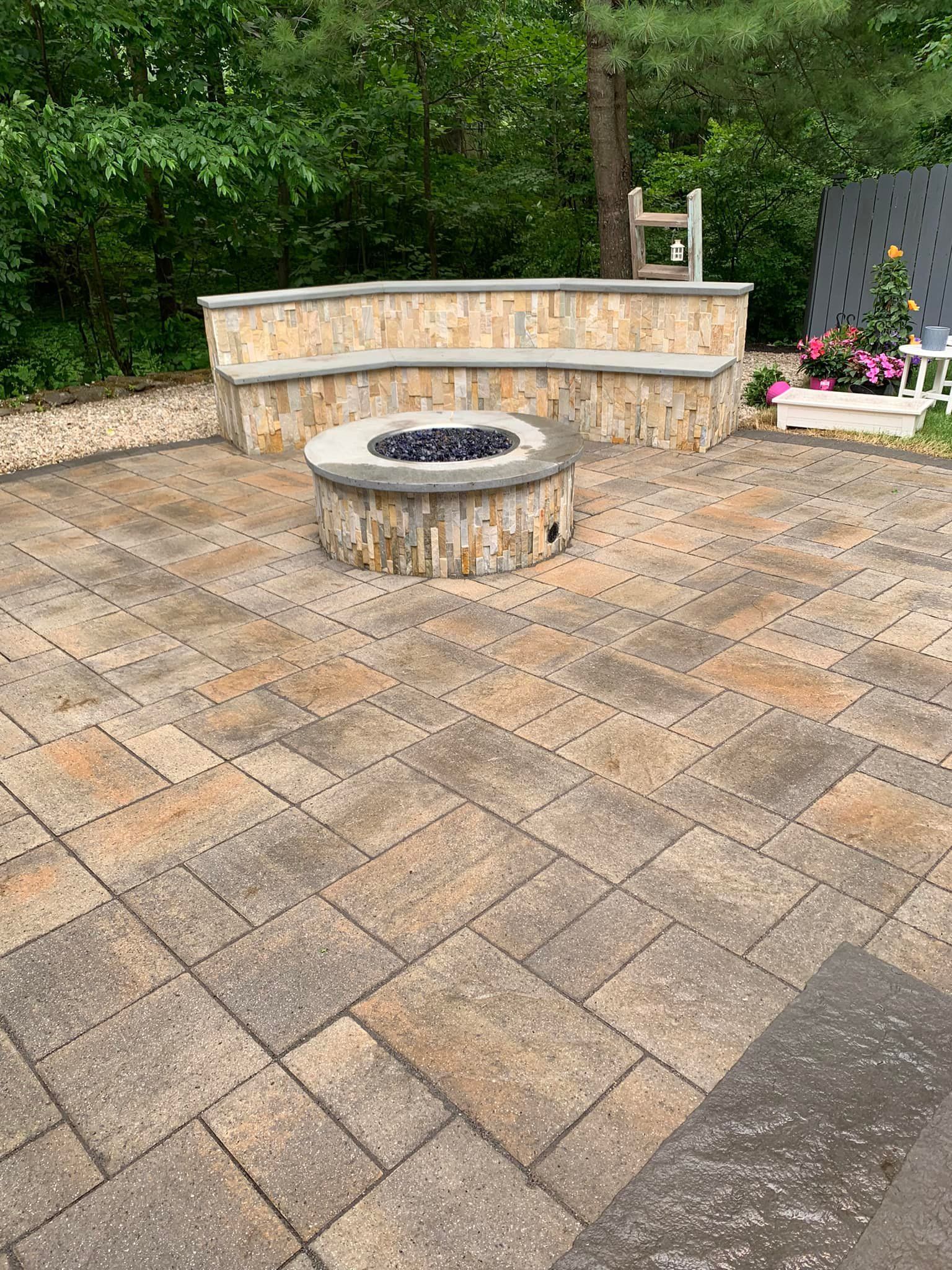 There is a fire pit in the middle of the patio.