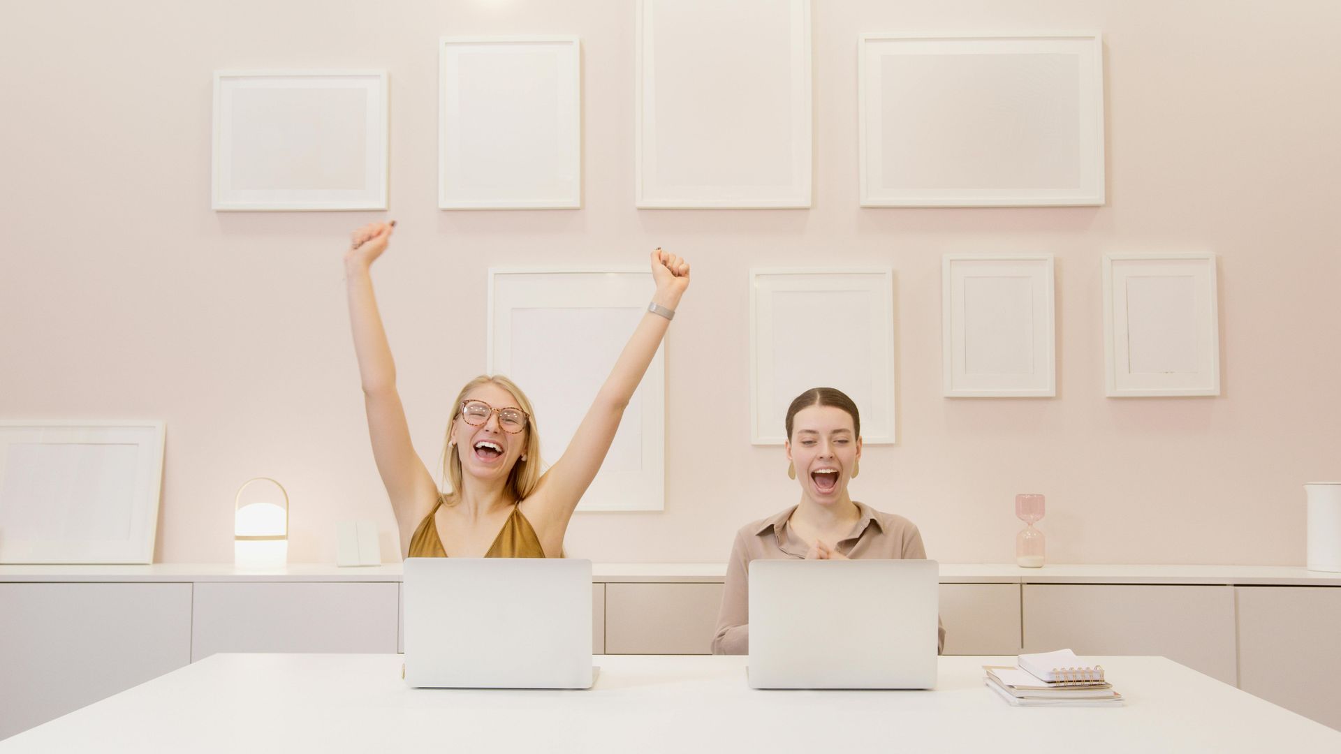 Two business women celebrating success