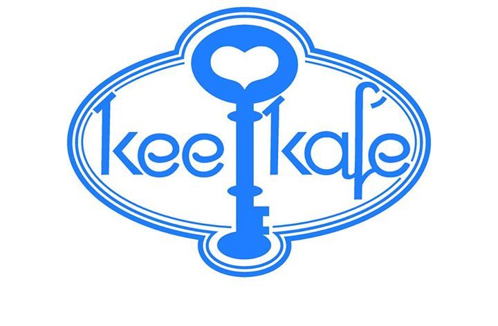 A blue logo for kee kafe with a heart shaped key