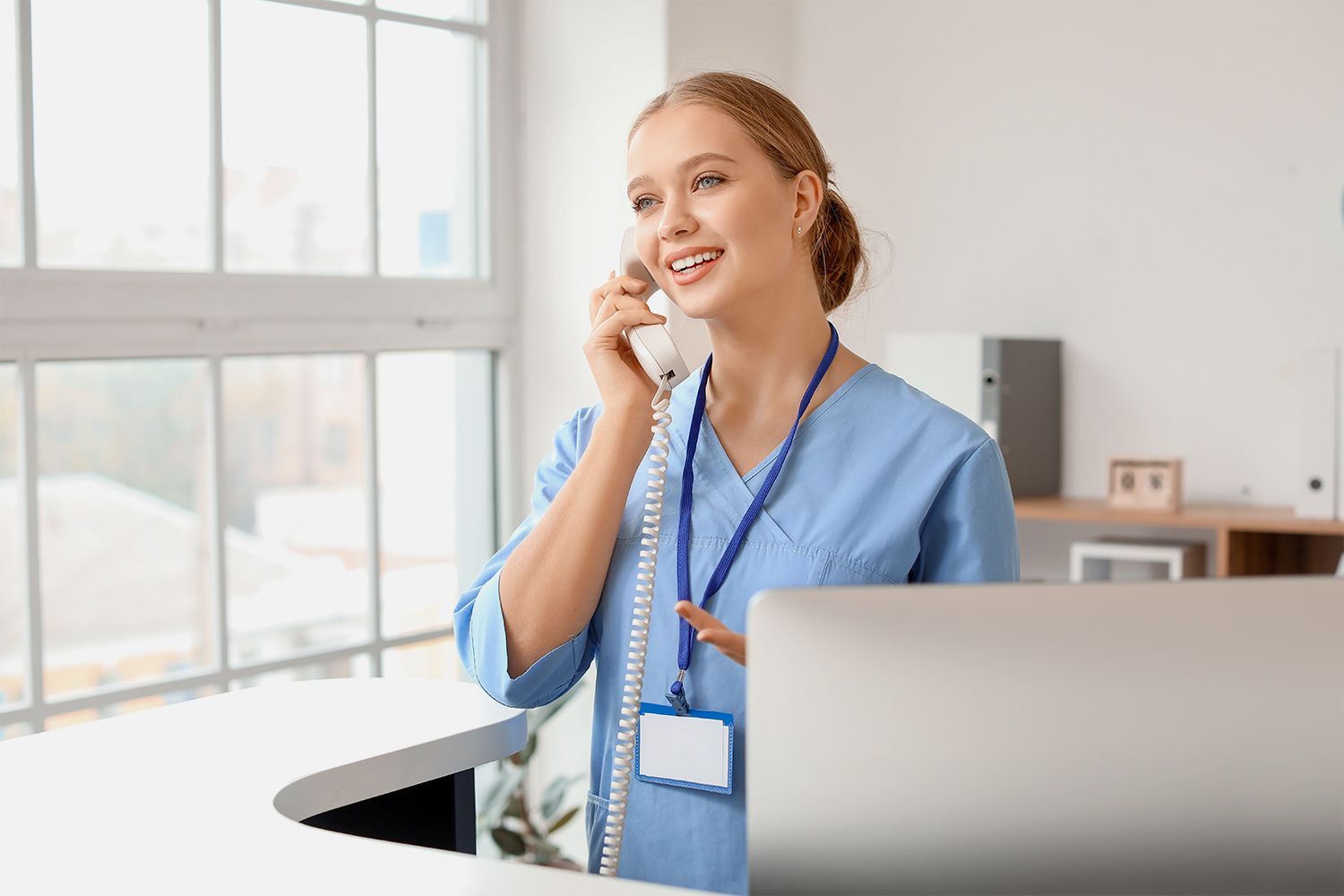 Medical receptionist answering a call