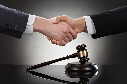 Shaking hands—Real Estate Law in Mansfield, OH