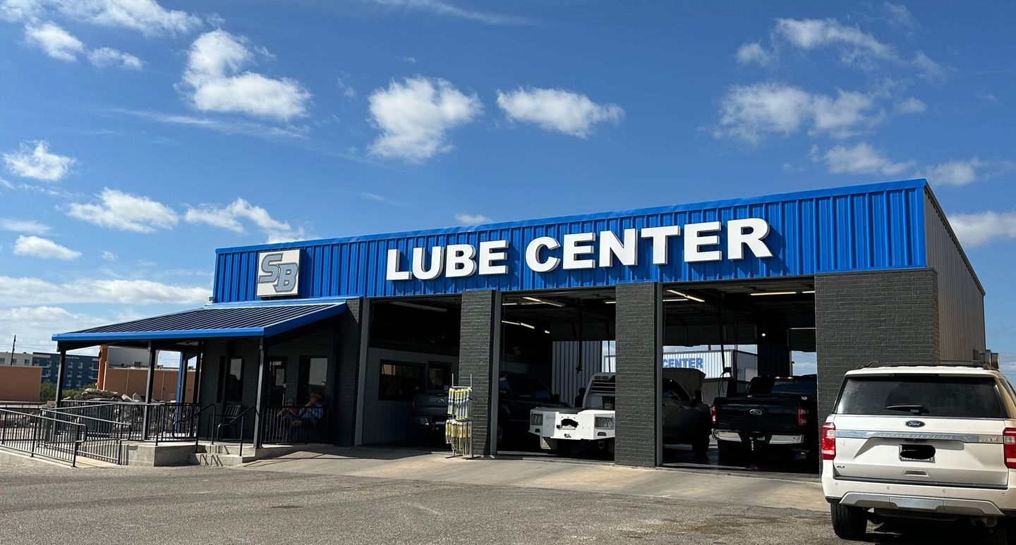 A blue building with the word lube center on it