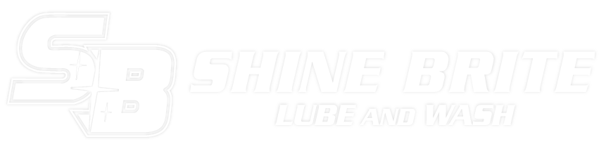 A white logo for a company called shine brite lube and wash