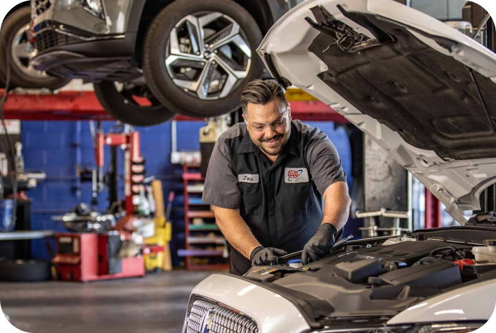 Mechanic working on a car | Bargain Tire & Service, Inc