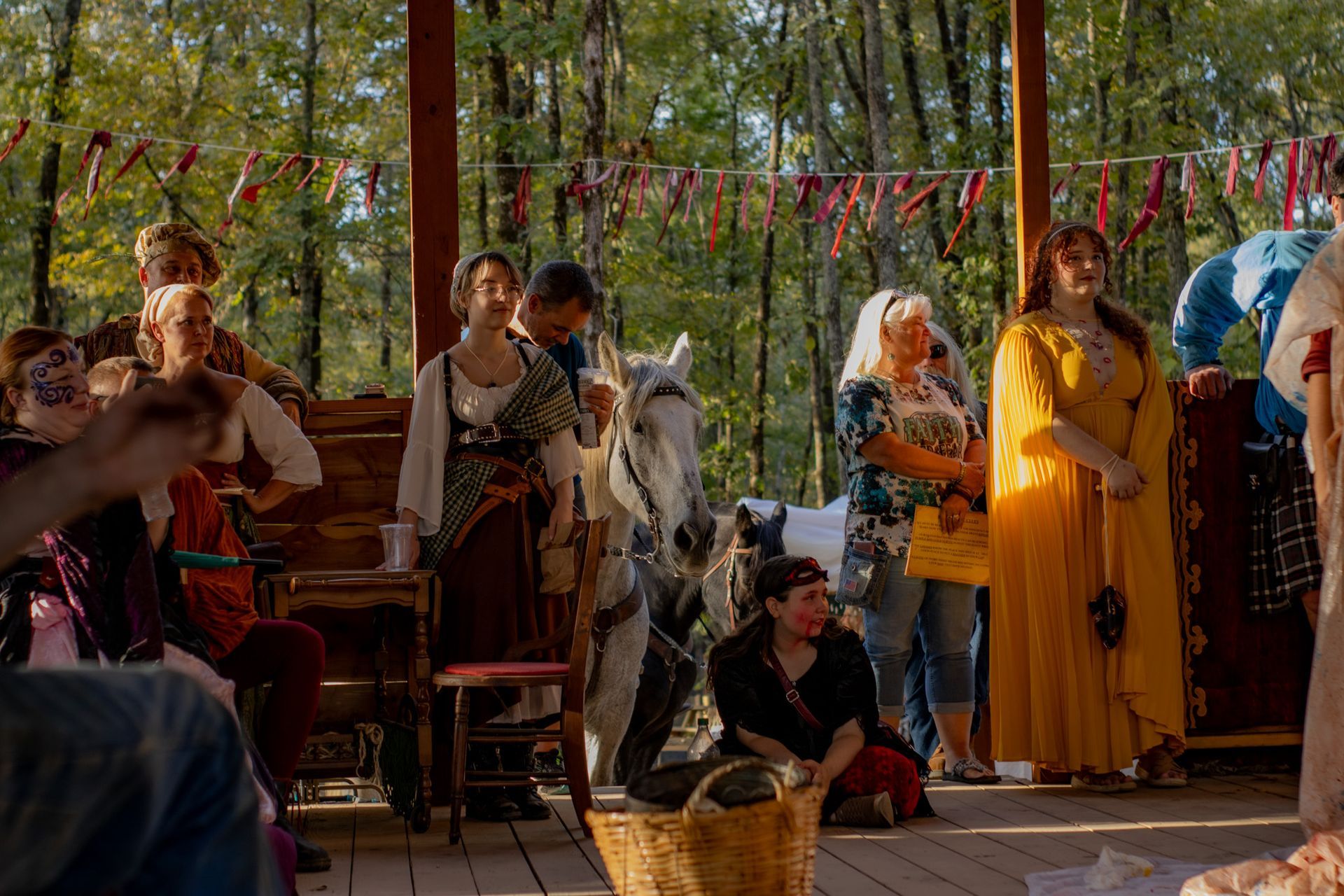 A group of people are standing around a horse.