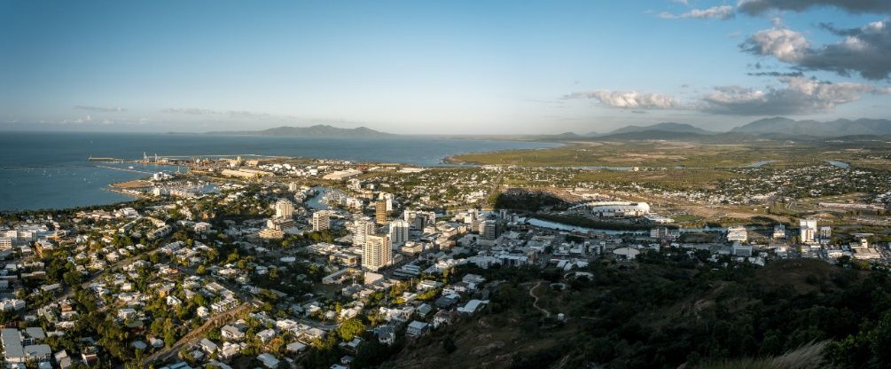 An Aerial View of a City With a Body of Water in the Background — Battery Assist QLD In Kunda Park, QLD