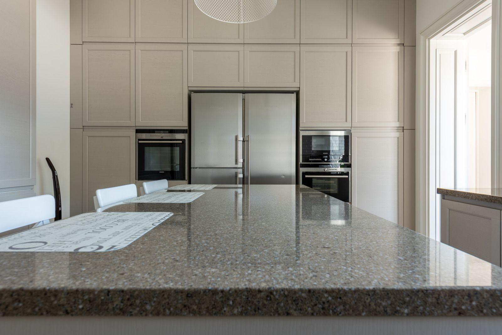 A kitchen with stainless steel appliances and a granite counter top.