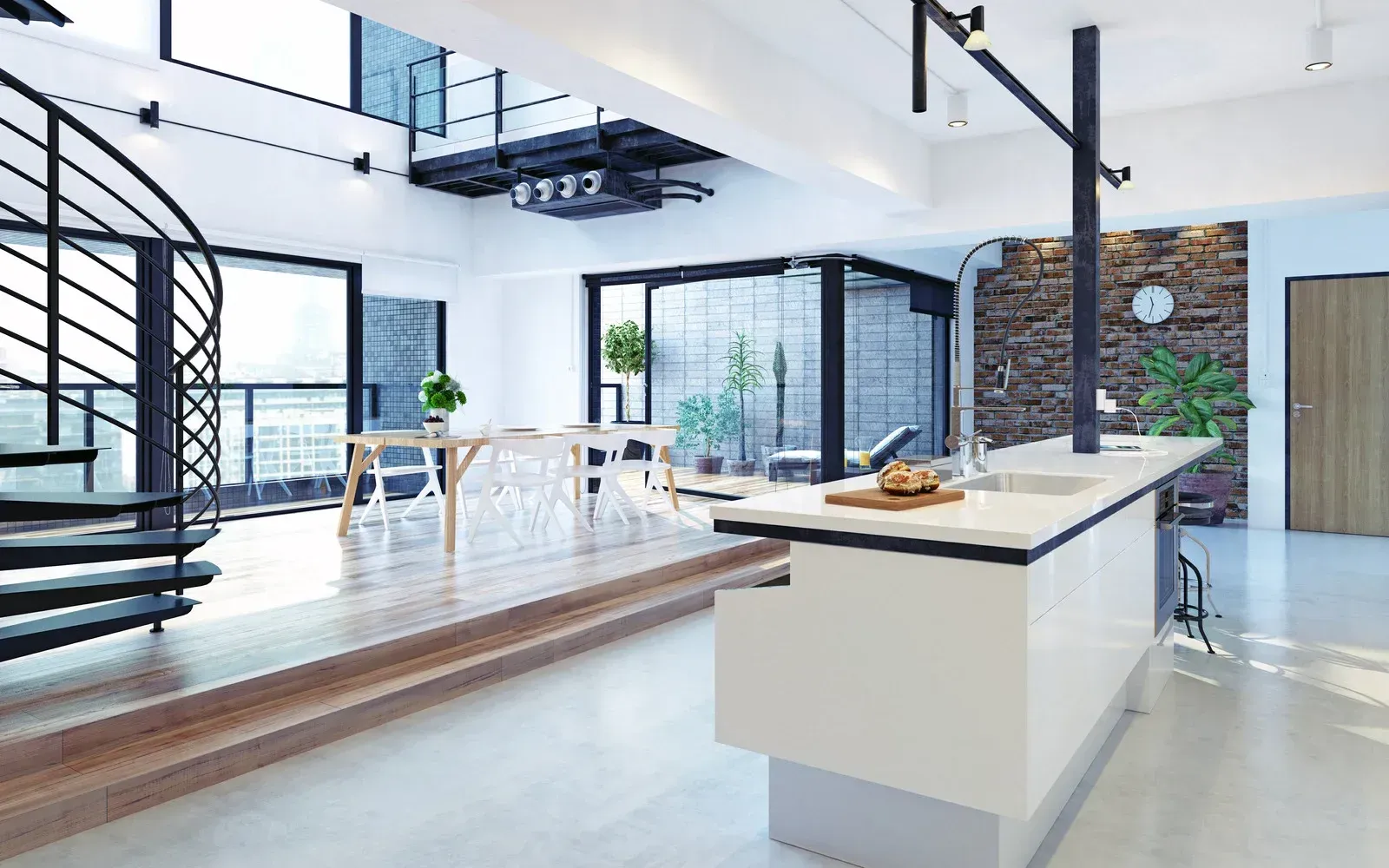 A modern kitchen with a spiral staircase and a large island.