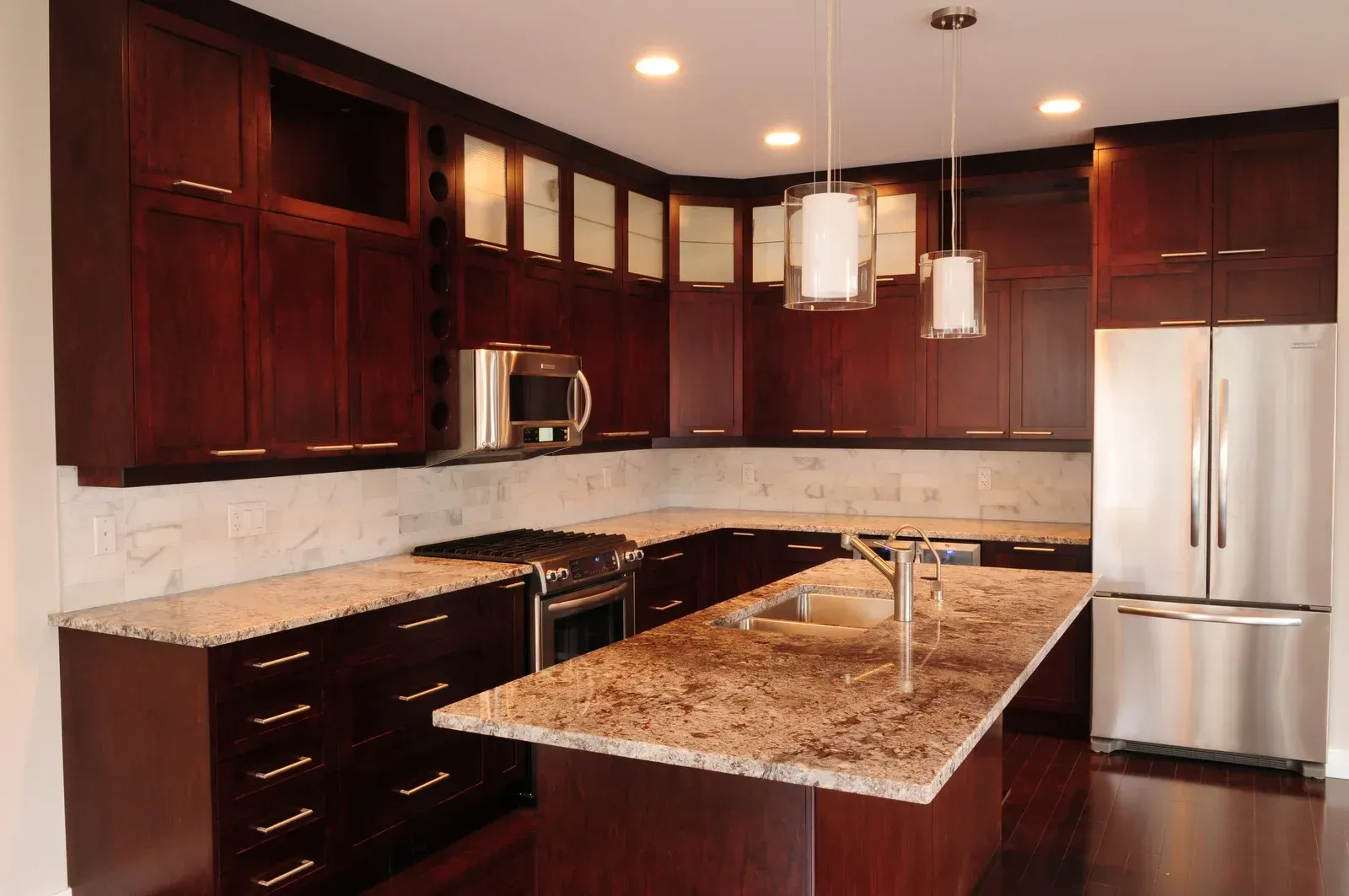 A kitchen with stainless steel appliances and granite counter tops