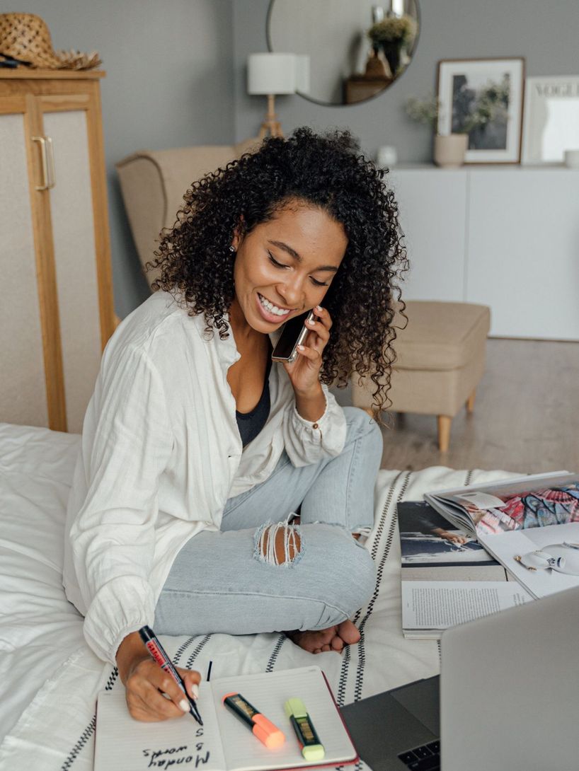 woman on the phone calling to book an appointment