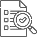A magnifying glass is looking at a checklist on a piece of paper.
