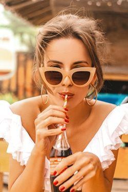 woman drinking soda in the summer time