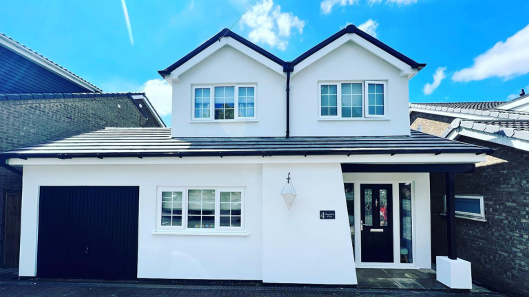 Modern detached house in the UK with JUB external wall insulation and white JUB external render