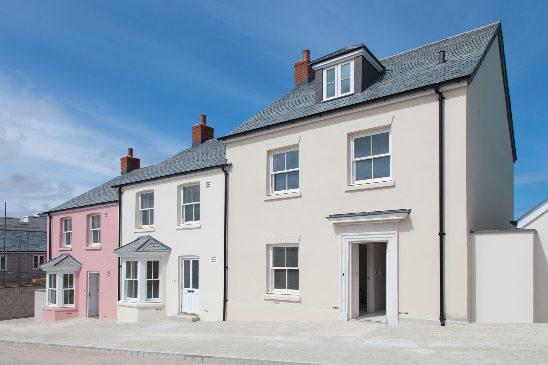 Row of houses with different types of external render colours