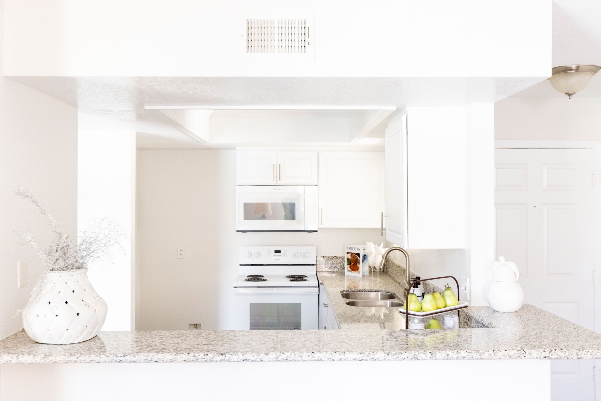 Kitchen photo with plenty of natural lighting shot from outside the kitchen