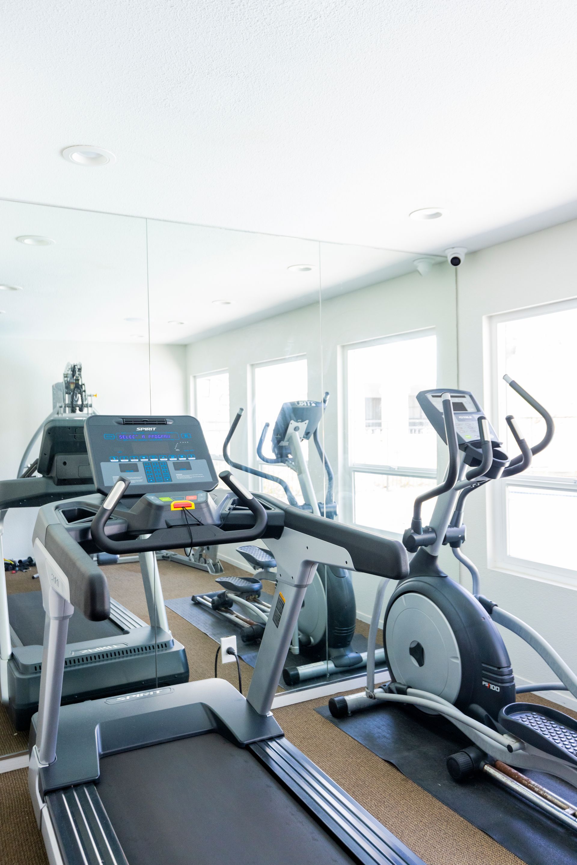 Fitness center photo with treadmill and more