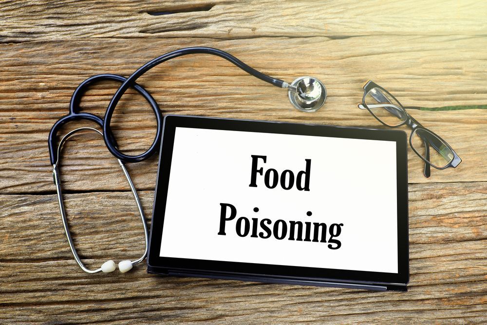 A tablet with the words `` food poisoning '' written on it.