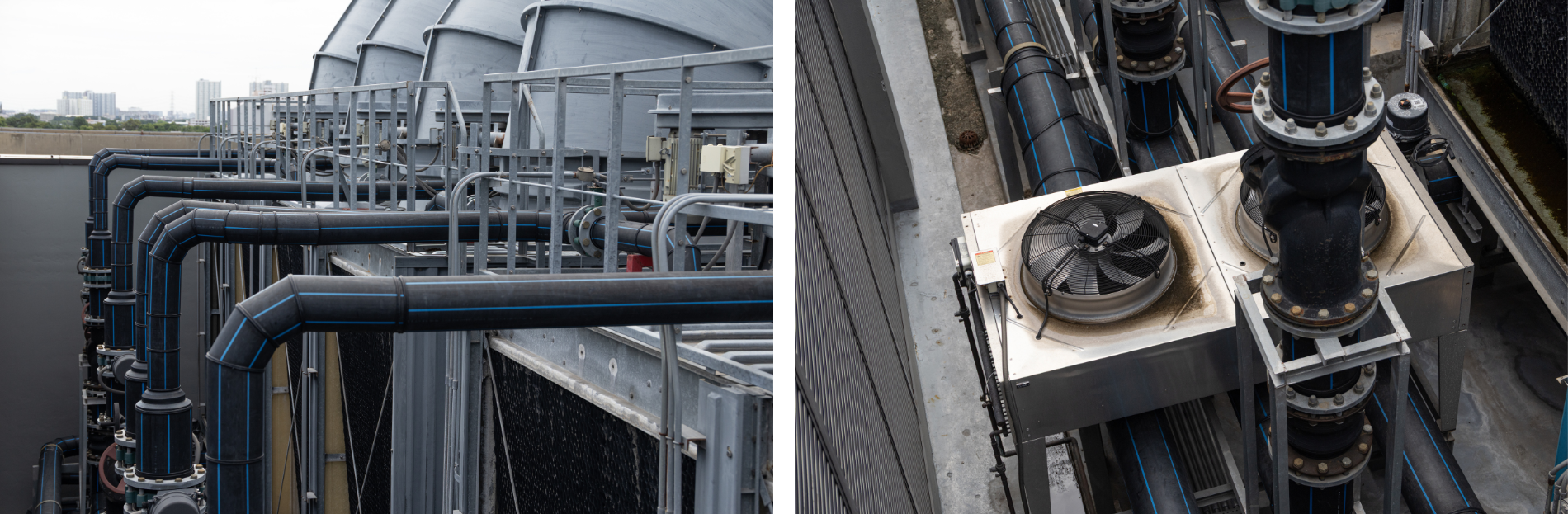 Industrial cooling towers with pipes and a fan.