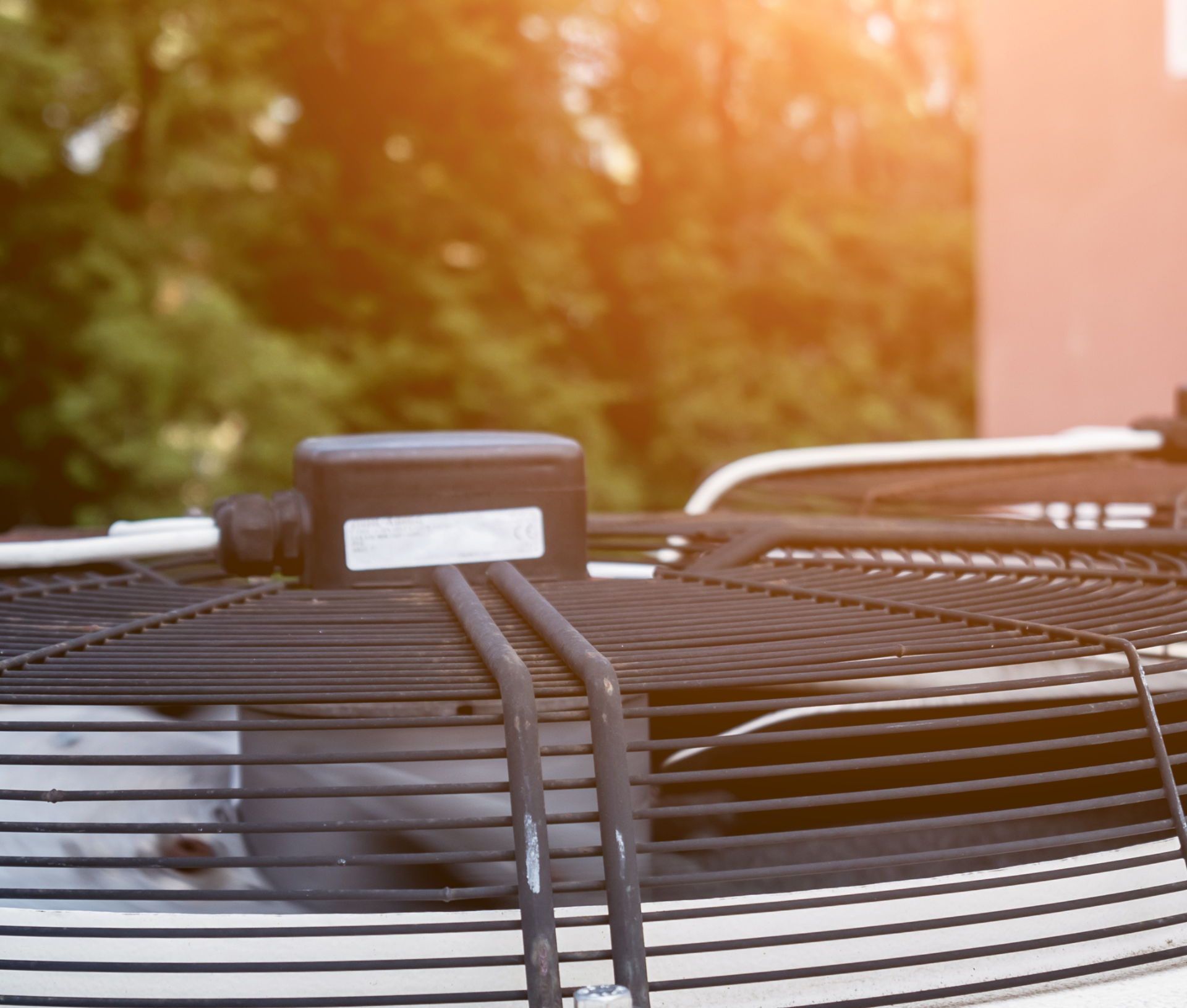 A close up of a fan on top of a building.