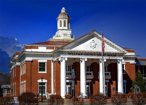 Millburn county courthouse with a dome on top of it