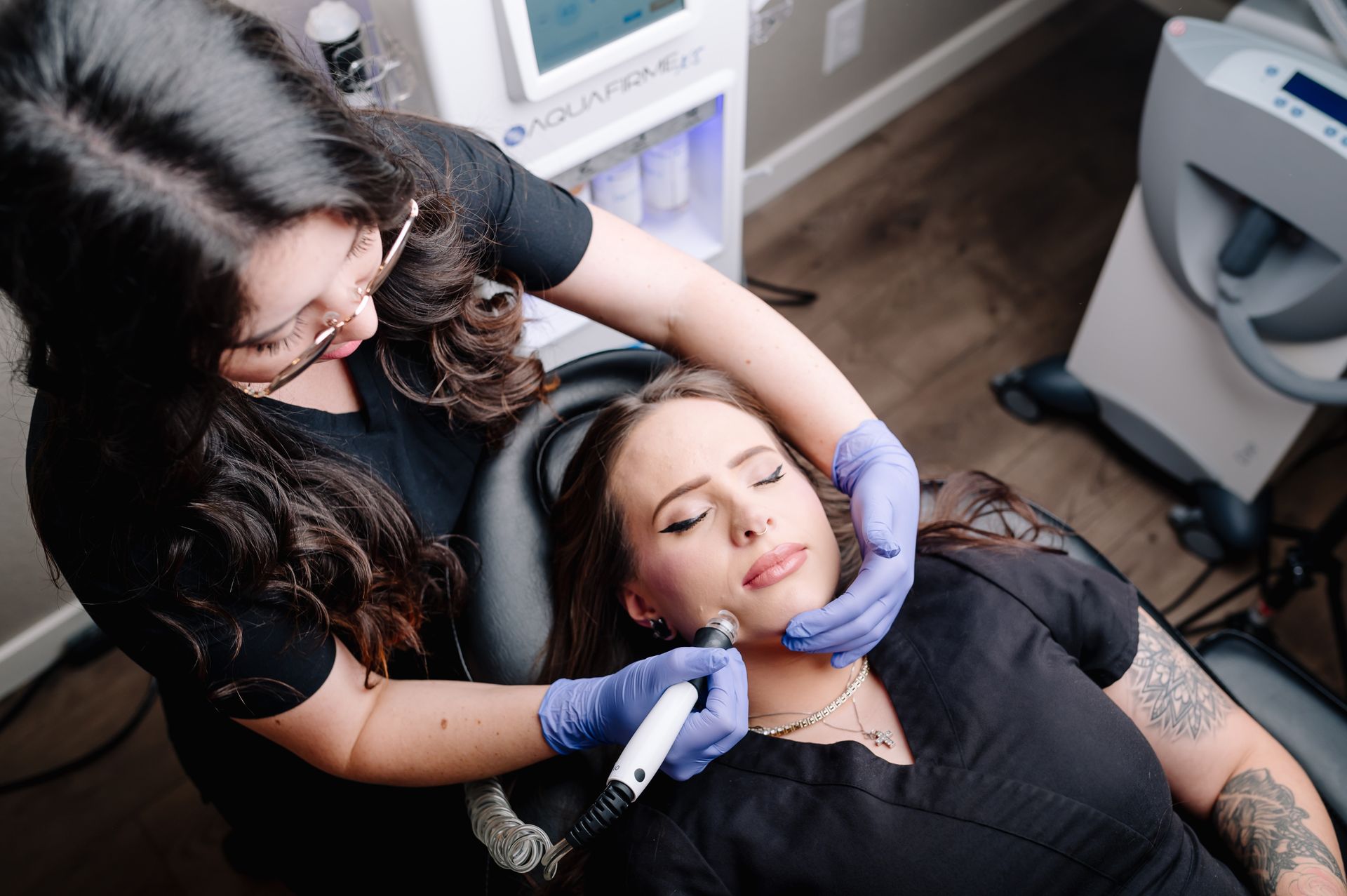 a woman is getting a facial treatment at a beauty salon .