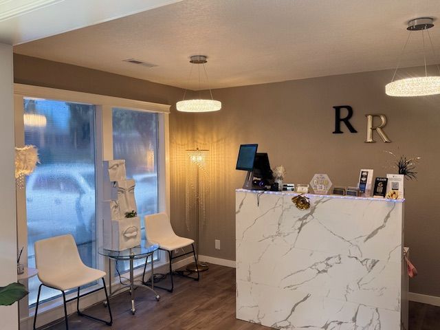 There is a marble counter in the middle of the room.