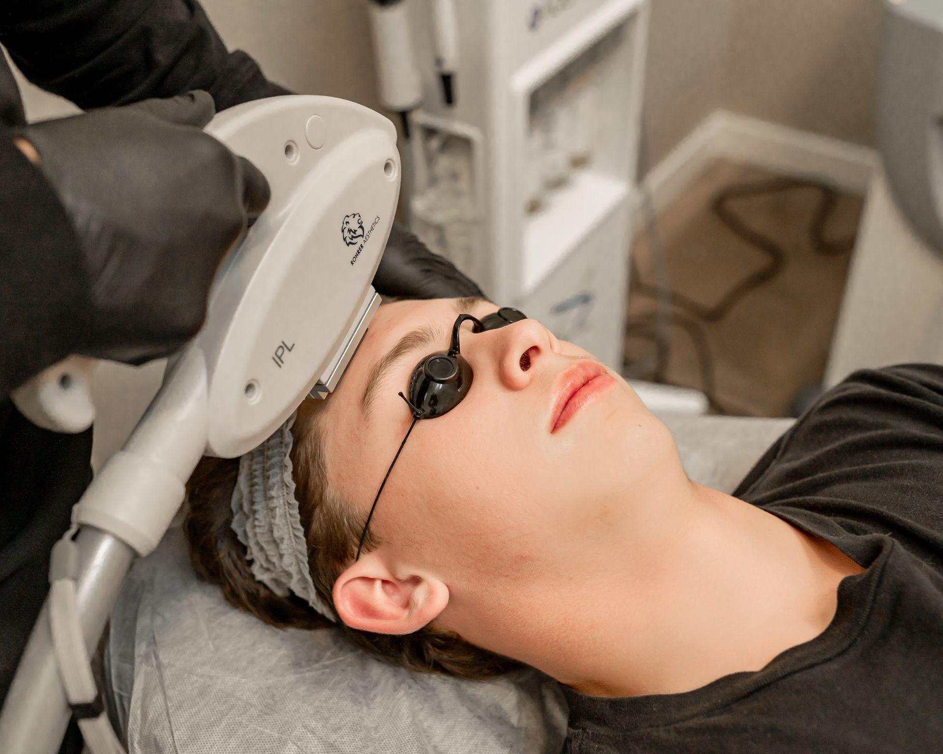 a woman is getting a facial treatment at a beauty salon .