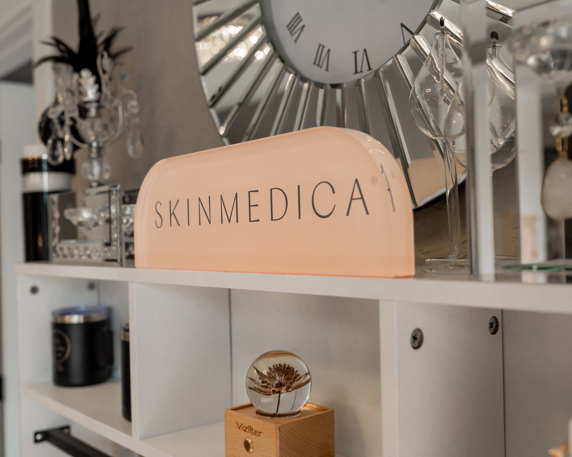 A shelf with a sign that says skinmedica on it