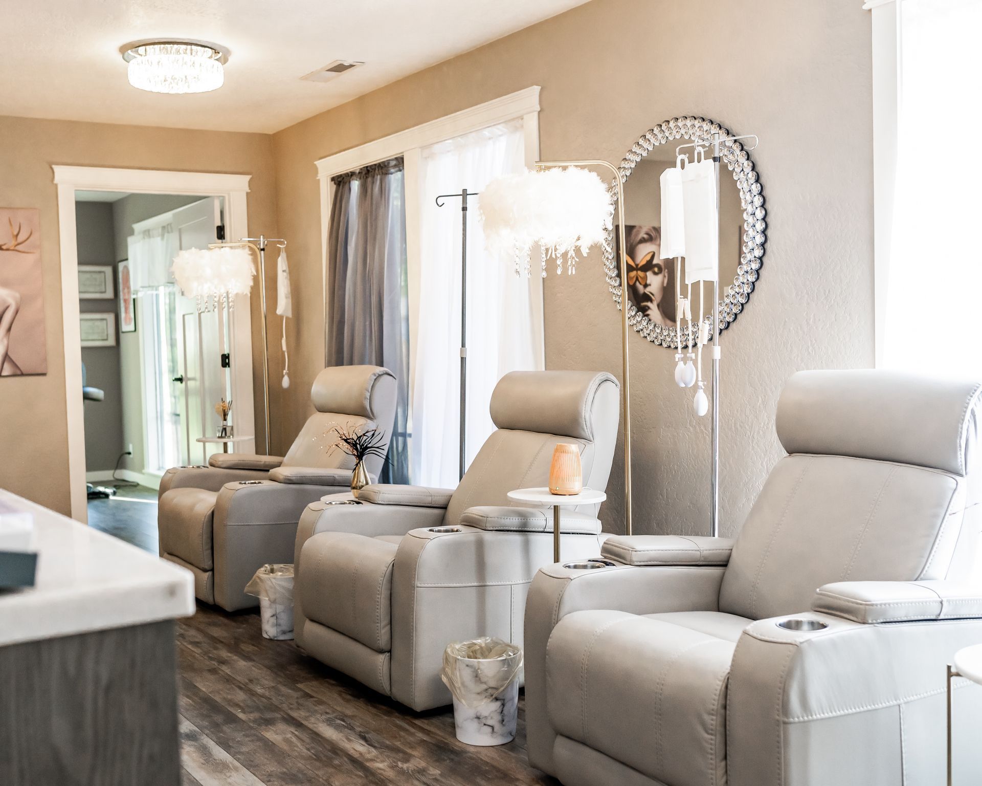 A room with a lot of chairs and a mirror on the wall.