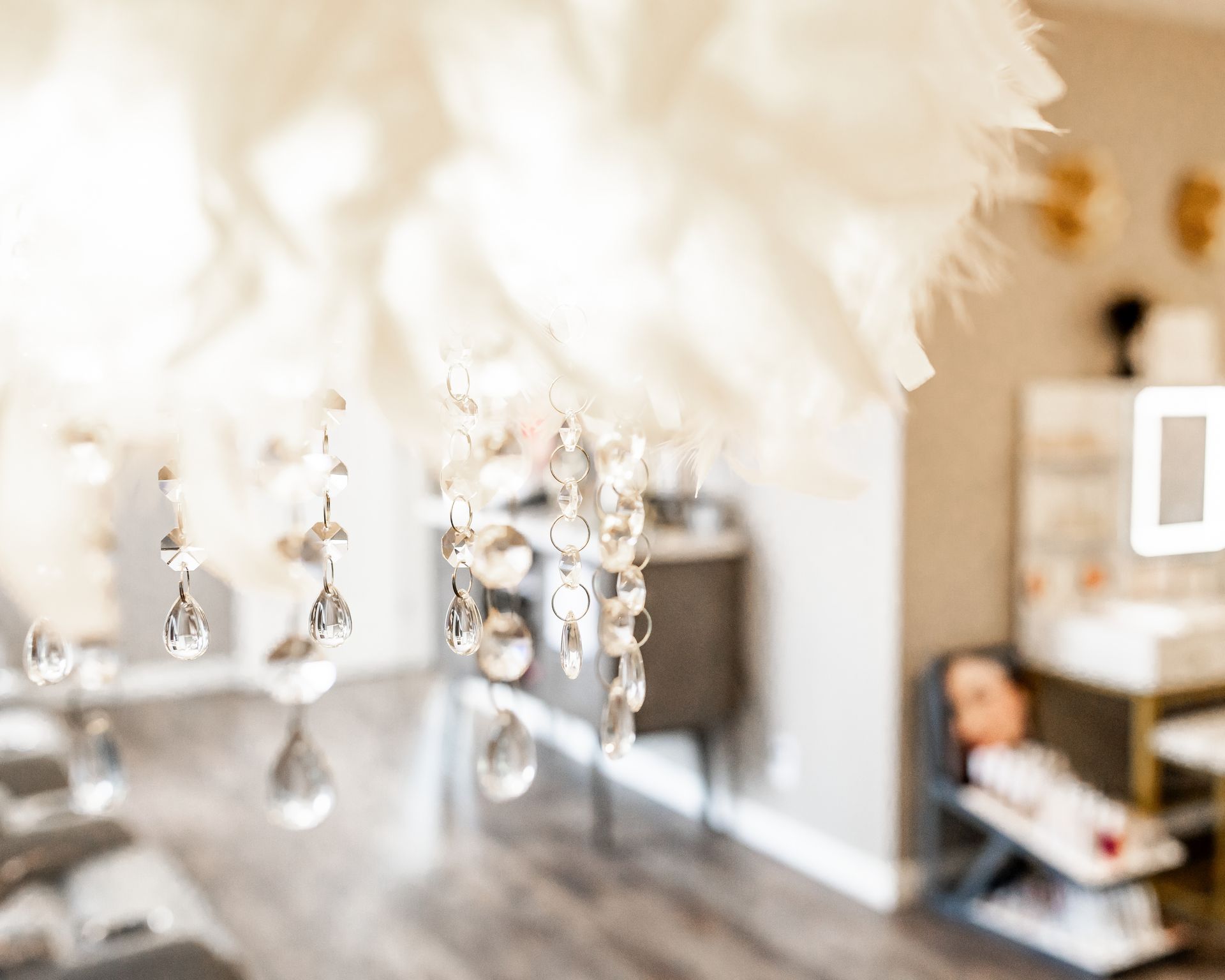 A blurry picture of a room with a chandelier hanging from the ceiling.