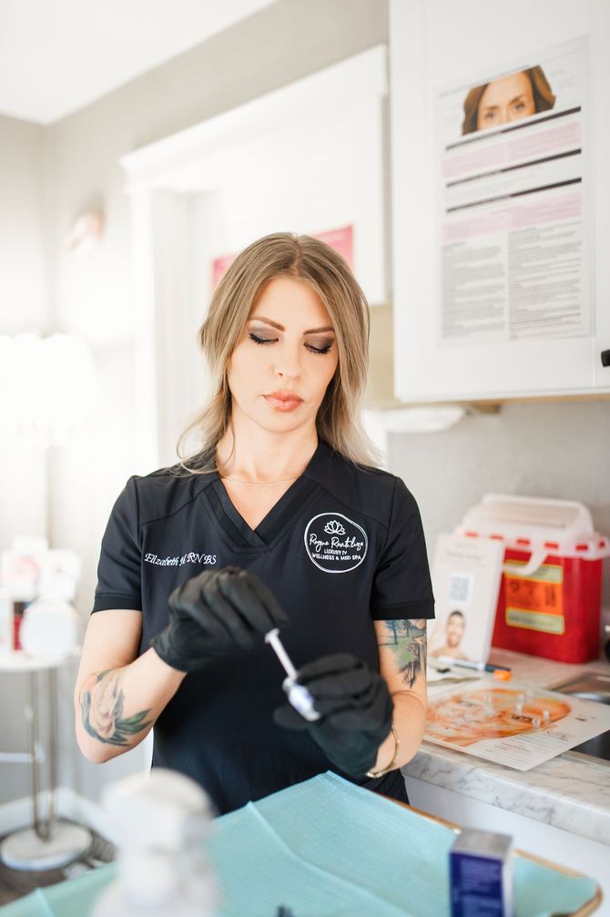 A group of women are sitting in recliner chairs in a room.