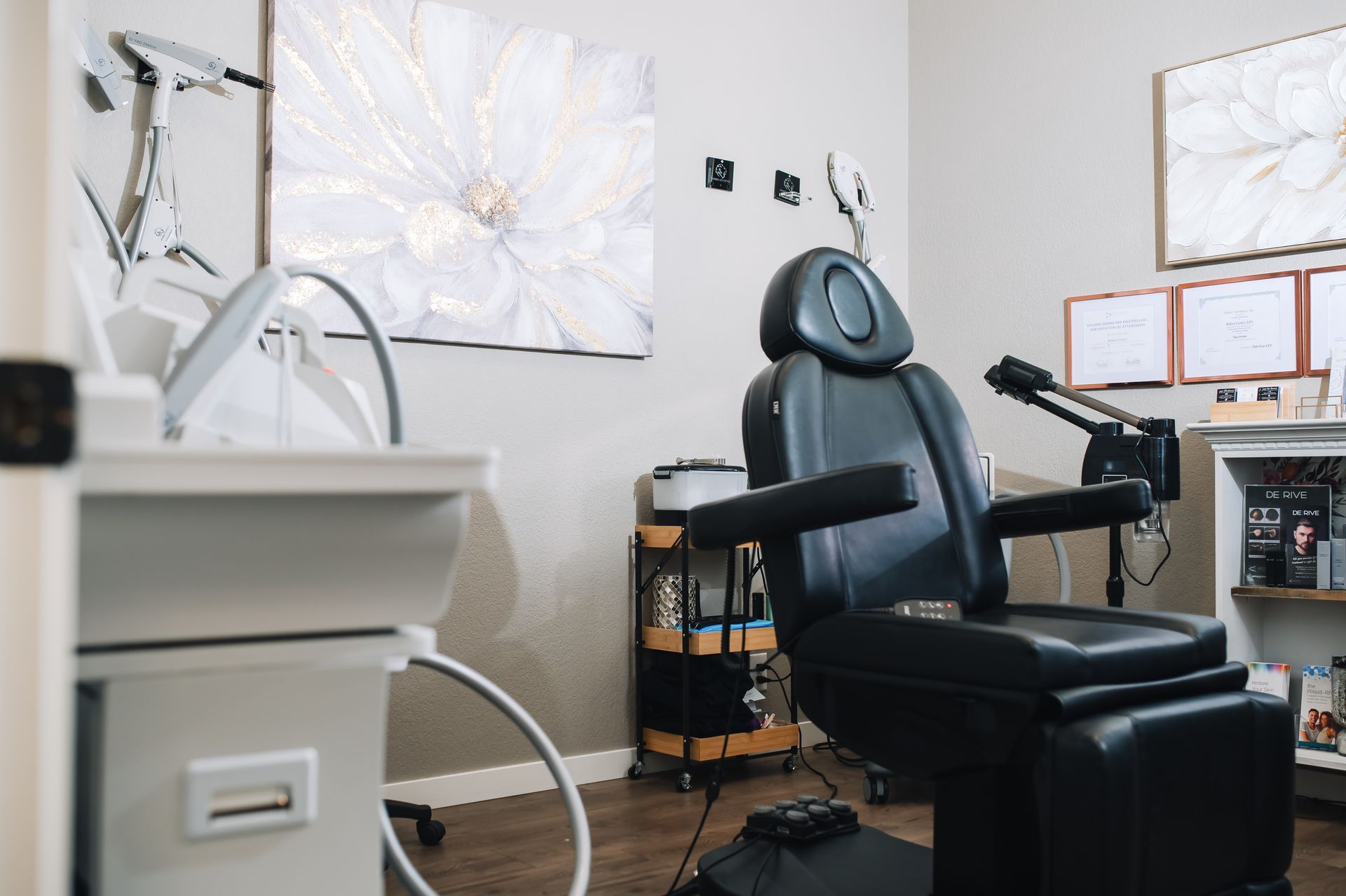 There is a black chair in the middle of the room.