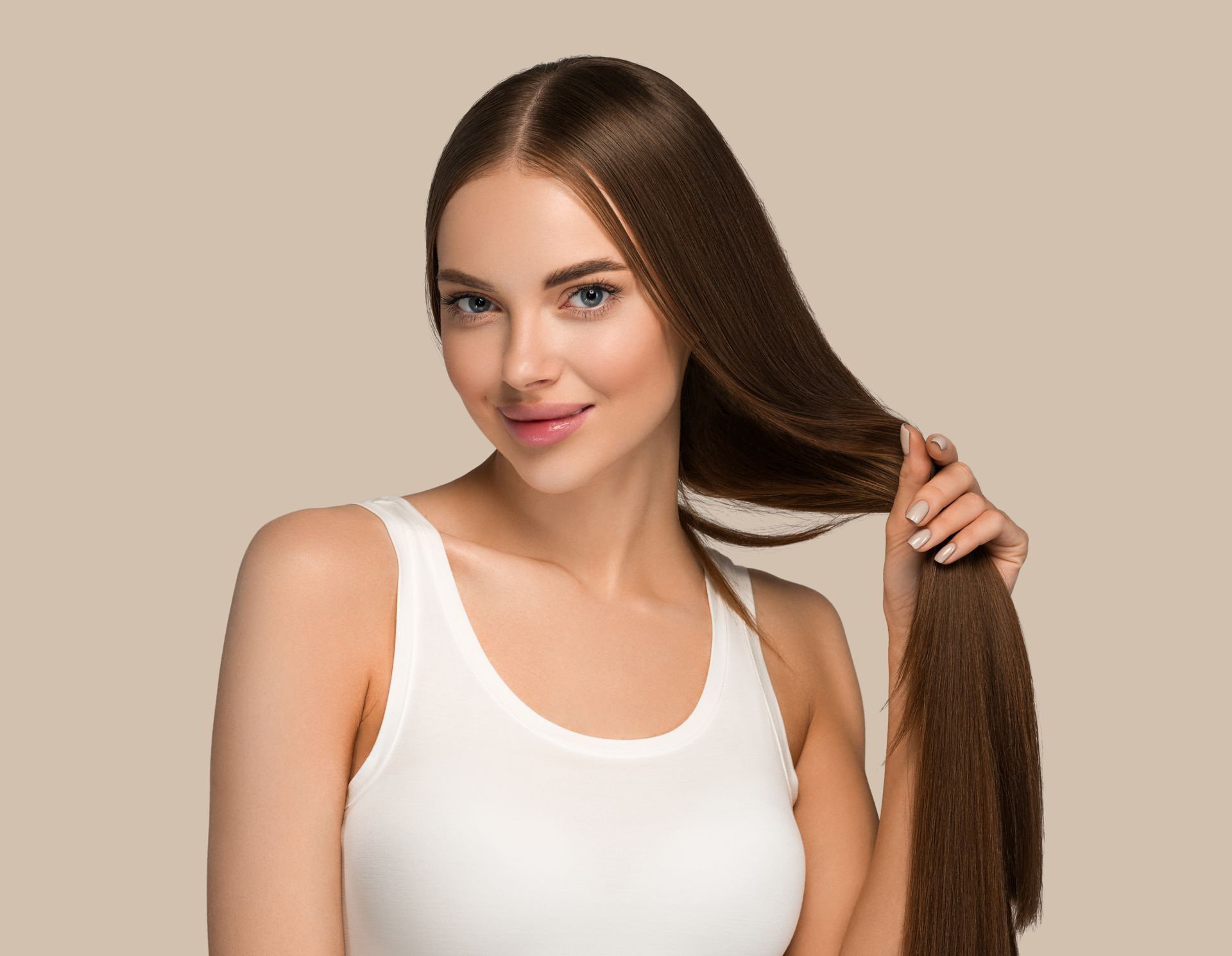 a woman in a white tank top is holding her long hair .