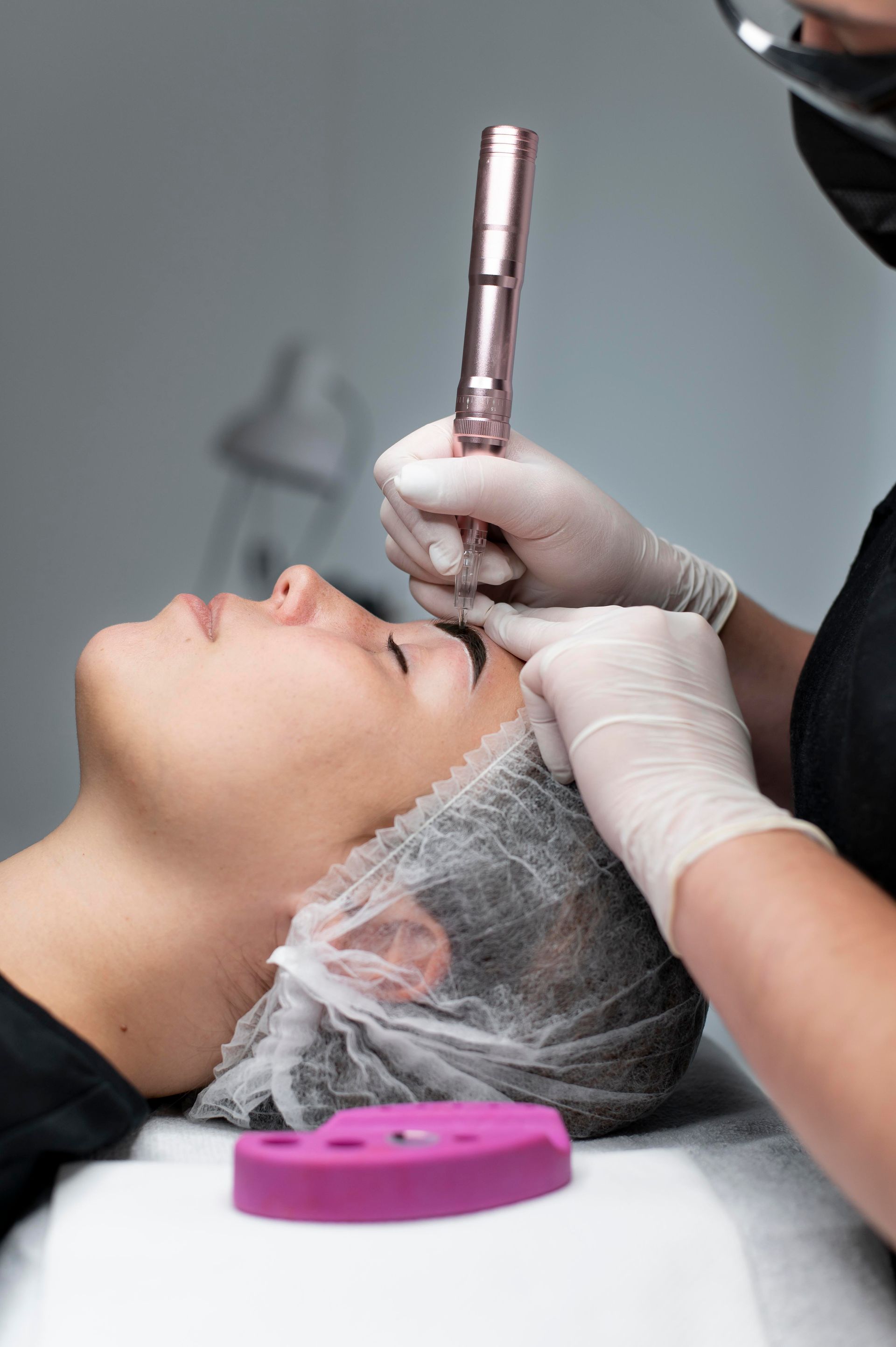 A woman is getting a facial treatment at a beauty salon.