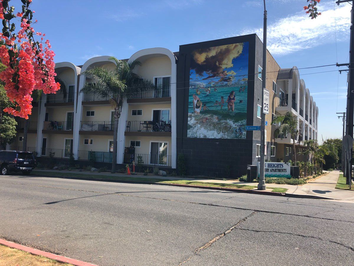 The heights with large mural on the side of the building